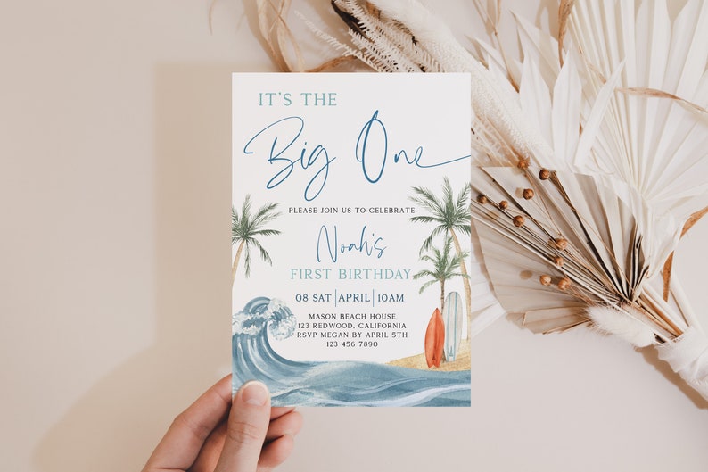 May include: A blue and white invitation with a watercolor wave design and palm trees. The text reads "It's the Big One" and "Noah's First Birthday". The invitation includes the date, time, location, and RSVP information.
