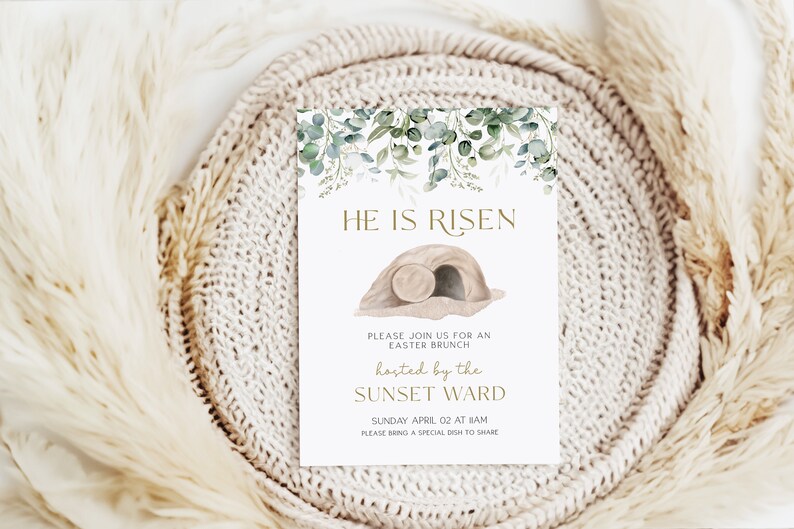 May include: A white card with green watercolor leaves and a gold inscription that reads "He is Risen". The card also features a brown illustration of a tomb with a rolling stone. The text below the illustration reads "Please join us for an Easter Brunch hosted by the Sunset Ward Sunday April 02 at 8am Please bring a special dish to share."