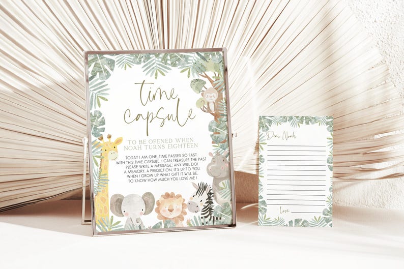 May include: A white card with green leaves and animal illustrations around the border. The card says "Time Capsule" and "To be opened when Noah turns eighteen."  The text continues, "Today I am one. Time passes so fast with this time capsule, I can treasure the past. Please write a message, any will do, a memory, a prediction. It's up to you. When I grow up what gift it will be to know how much you love me."