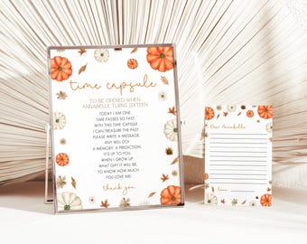 May include: A white card with a time capsule message for a 16th birthday. The card is decorated with orange and white pumpkins and leaves. The text on the card reads: "Time Capsule To Be Opened When Annabelle Turns Sixteen Today I am One Time Passes So Fast With This Time Capsule I Can Treasure The Past Please Write A Message Any Will Do A Memory, A Prediction It's Up To You When I Grow Up What Gift It Will Be To Know How Much You Love Me Thank You".