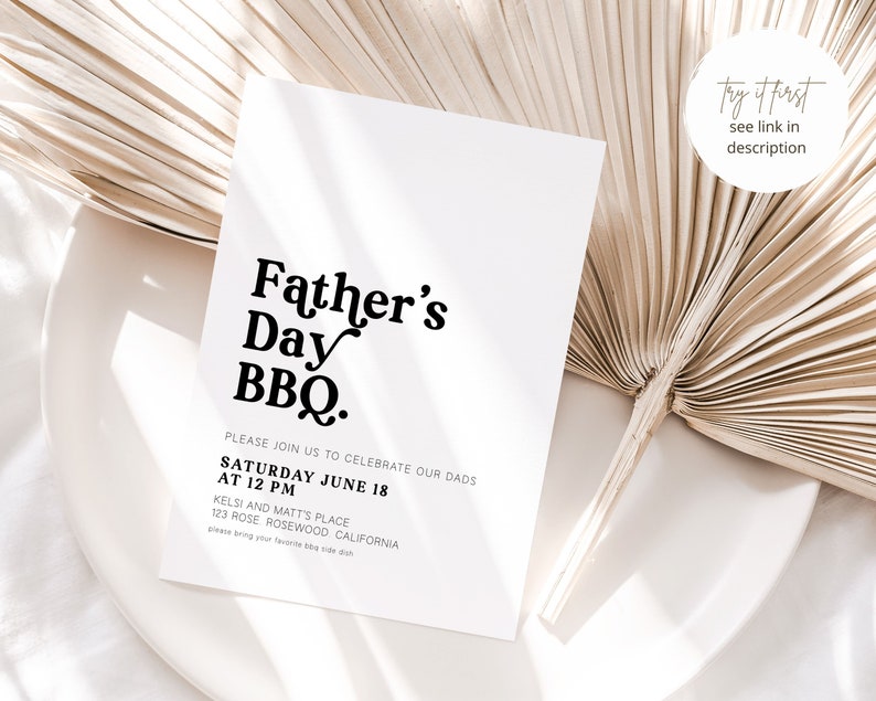 May include: A white Father's Day BBQ invitation with black text. The invitation includes the date, time, and location details. The invitation is placed on a white plate with a dried palm leaf.