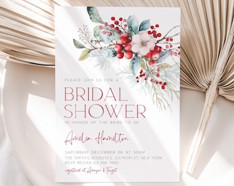 May include: A white invitation card with burgundy text and floral accents. The text reads "Bridal Shower" and includes details such as the date, time, location, and RSVP information. The floral arrangement features red berries, white flowers, and green leaves.