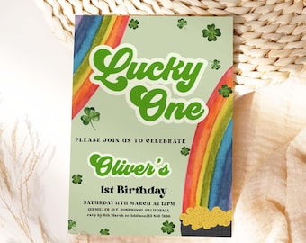 May include: A green and white invitation with a rainbow and a pot of gold. The text reads "Lucky One" and "Oliver's 1st Birthday".