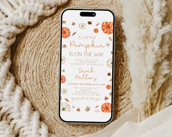 May include: A white phone screen with a baby shower invitation. The invitation has a fall theme with pumpkins, leaves, and flowers. The text reads "A Little Pumpkin is on the Way" and includes the date, time, and location of the shower. The invitation also includes the name of the mom-to-be, Sarah Miller's, and the RSVP information.