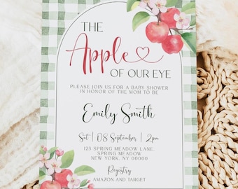 May include: Baby shower invitation with a green and white gingham border. The invitation features the text "The Apple of Our Eye" in red script, with apple illustrations. Details include the mom-to-be's name, date, time, and location.
