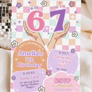 May include: A colorful birthday invitation with the text "I WAS 6, NOW I'M 7". The invitation includes details for Amelia's 7th birthday, including the date, time, and location. The design features a checkered background and floral accents.