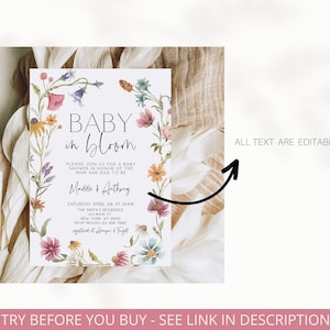 Op de afbeelding: Een bloemige babyshower-uitnodiging met een aquarelkrans van bloemen en de tekst "Baby in Bloom". De uitnodiging bevat de namen "Maddie & Anthony", de datum "Zaterdag 8 april om 10:00 uur", de locatie "The Smith's Residence 123 Main St New York, NY 10001", en de RSVP-informatie "RSVP Megan 123 456 7890 registrant at Amazon & Target". De tekst "ALL TEXT ARE EDITABLE" is ook op de uitnodiging opgenomen.