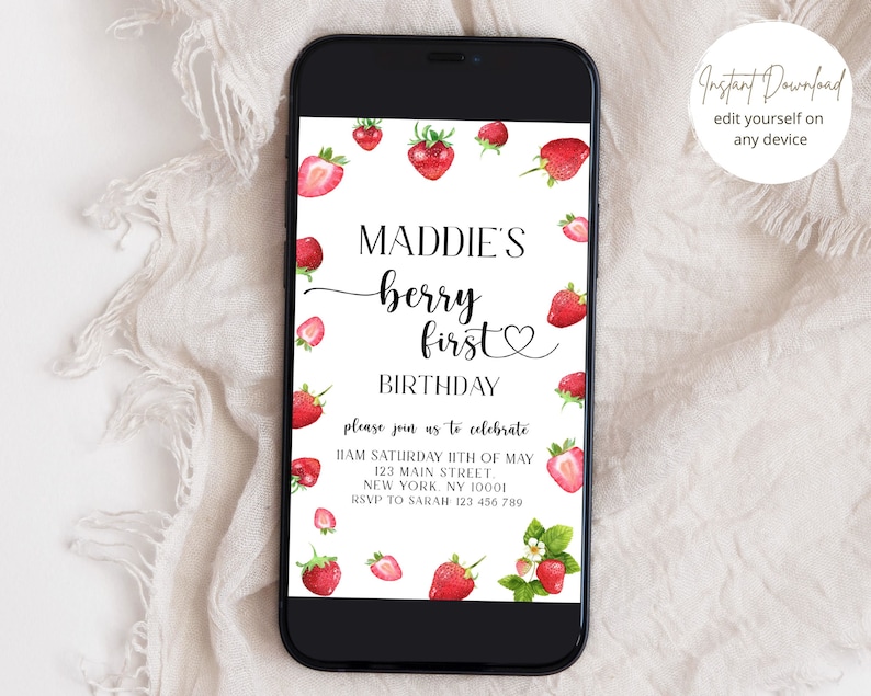 May include: A digital invitation with a white background and red strawberries. The text reads "Maddie's Berry First Birthday" with a heart symbol. The invitation includes the date, time, address, and RSVP information.