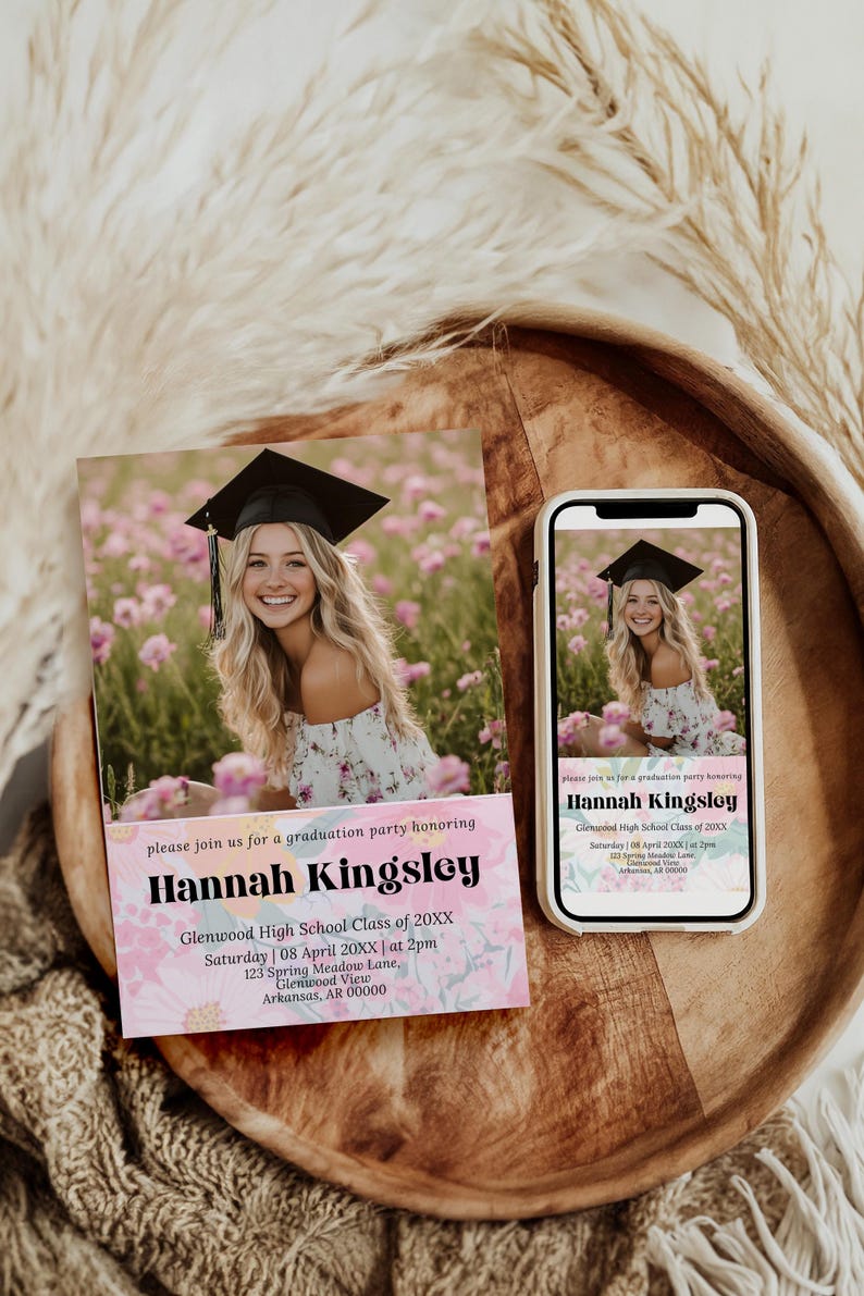May include: Graduation party invitation featuring a photo of a graduate in a cap and gown, surrounded by pink flowers. The invitation includes the graduate's name, school, date, time, and location.