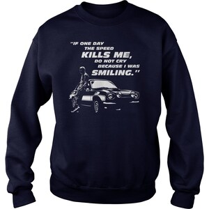 May include: Navy blue sweatshirt with a white graphic print of a car and a person. The text on the graphic reads "IF ONE DAY THE SPEED KILLS ME, DO NOT CRY BECAUSE I WAS SMILING."