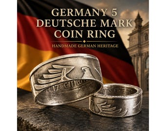 May include: Two silver-toned metal rings crafted from Germany 5 Deutsche Mark coins, featuring an embossed eagle design on the outer band and visible lettering along the inner rim, displayed against a background with the text GERMANY 5 DEUTSCHE MARK COIN RING.