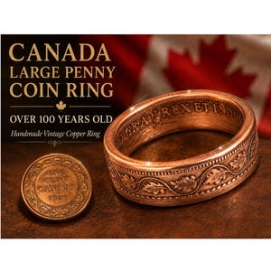 May include: A handmade copper ring made from a Canadian penny. The ring is a large size and features intricate details. The text "CANADA LARGE PENNY COIN RING" is displayed above the ring. The ring is over 100 years old.
