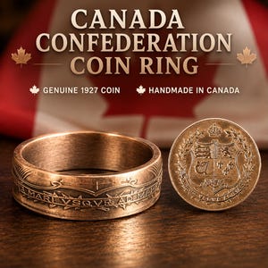 May include: A metallic ring crafted from a genuine 1927 Canadian coin, featuring embossed Latin text and intricate heraldic details. Beside it sits a matching coin displaying a detailed coat of arms with a crown, shield, and floral motifs.