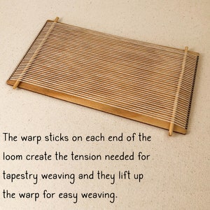 May include: A wooden tapestry loom with warp sticks on each end. The warp sticks create tension for weaving and lift up the warp for easy weaving.