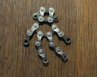 Iron man (or Shaun-the-sheep) made from bicycle chain