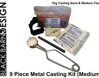 May include: A 9-piece metal casting kit (medium) with a bag of 1 kg casting sand, a medium flask, and other tools. The kit includes borax powder, a crucible, and a pouring rod. The text "BLACK BARN DESIGN" is visible.