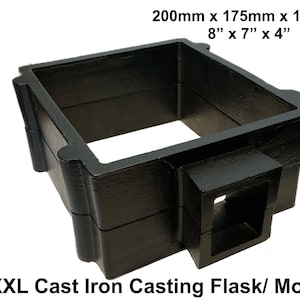 May include: A black XXL cast iron casting flask mould with a rectangular frame and a protruding square opening. The text BLACK BARN DESIGN is visible on the left, and the dimensions 200mm x 175mm x 100mm or 8" x 7" x 4" are printed at the top.