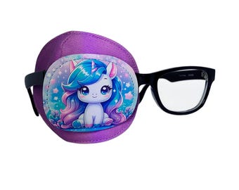 May include: A purple eye patch with a cartoon unicorn design, paired with black-framed eyeglasses. The unicorn has blue and pink hair, and the patch is designed to fit over the eye.