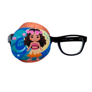 May include: A blue and orange eye patch with a cartoon image of a girl with brown hair wearing a flower crown and a yellow and orange skirt. The eye patch is attached to a pair of black framed glasses.