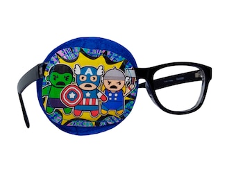 May include: A blue eye patch with a comic book design featuring the Avengers: Hulk, Captain America, and Thor. The eye patch is attached to black framed glasses.
