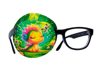 May include: A green eye patch with a cartoon dragon and a dragonfly design. The eye patch is attached to a pair of black framed glasses.