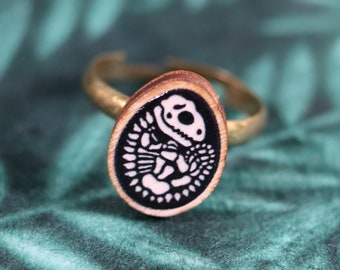 Ring with wooden Dinosaur Egg skull charm