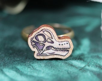 Ring with wooden Brachiosaurus skull charm