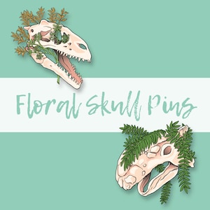 May include: Two floral skull pins. The first pin is a white dinosaur skull with green leaves. The second pin is a white skull with green fern leaves. The text "Floral Skull Pins" is written in white on a blue background.