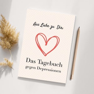 May include: A pink and white journal with a red heart and the text "Aus Liebe zu Dir. Das Tagebuch gegen Depressionen".
