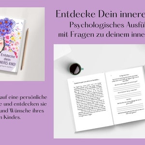 May include: A closed book with a white cover and black text that reads "Entdecke Dein Inneres Kind! Psychologisches Ausf&uuml;llbuch mit Fragen zu deinem inneren Kind." The book is open to a page with black text and lines for writing. The book is on a white surface with a cup of coffee and a small bouquet of white flowers.