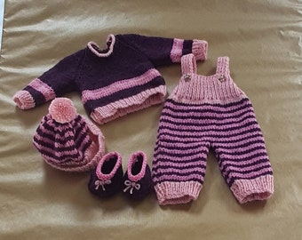 Hand knitted dolls clothes, trousers, dungarees, jumpers and hats.