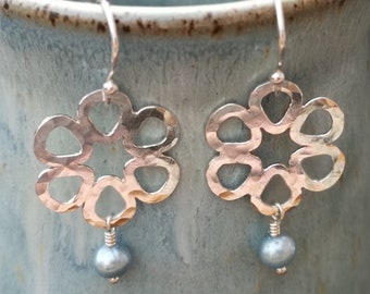 Handmade hammered silver daisy earrings with freshwater pearl on sterling silver hook wires. Flower earrings. June birthstone