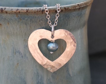 Handmade hammered silver heart pendant with freshwater pearl on silver trace chain. Heart necklace. Spring bride. Wedding jewellery.