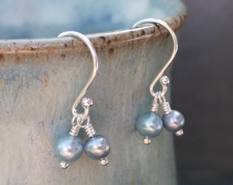 Contemporary handmade duck egg blue pearl earrings on sterling silver hook wires. Double cluster pearl earrings. June birthstone