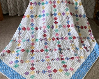 Trip around the world.  Classic quilt. Quilted with Baptist Fan