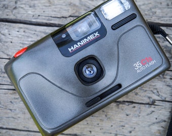 Cámara de película de 35 mm "Hanimex" Manual de apuntar y disparar con flash. Probado