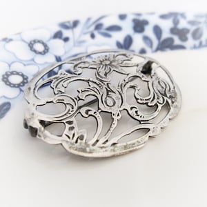 Old Dutch style sterling silver openwork floral brooch. Vintage jewelry from Holland.