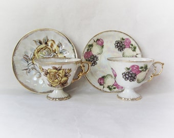 Ucagco et Brinn's Pittsburgh Pa Japon ensemble de 2 paires de thés en porcelaine. Motifs roses jaunes et fruits. Lustre japonais vintage.