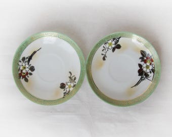 Dai Nippon (Great Japan) Satsuma Kutani set of two saucers. Meiji eggshell porcelain. Hand painted plum blossom. Japanese antique ware.
