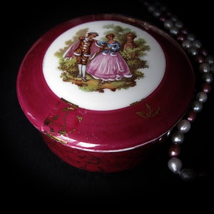 Vintage Limoges porcelain trinket, pill box, bonbonniere. Burgundy and gold. Fragonard Courting Couple. Made in France.