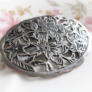 Old Dutch style sterling silver openwork floral brooch. Vintage jewelry from Holland.