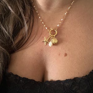 Gold-plated steel starfish and shell charm necklace - starfish charm necklace - gold and white necklace - gold and blue necklace