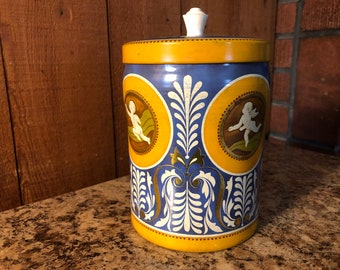 Blue biscuit tin with chrerubs