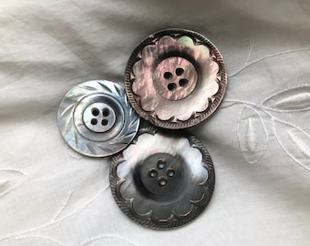 Carved mother of pearl smoke buttons