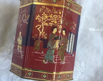 Red octagonal chinese tea tin with scene