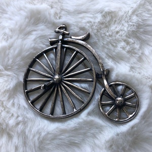 Silver bicycle brooch