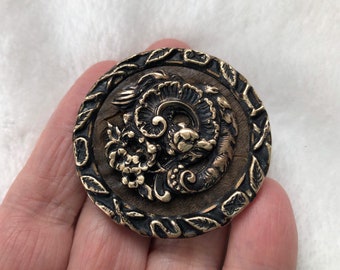Brass and leather Dragon button with border