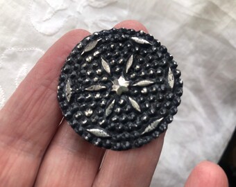 Silver starburst button