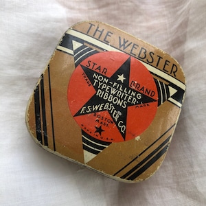 Small tin with star design for typing ribbon
