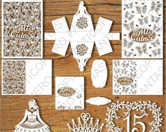 May include: A set of white paper cutouts for a quinceañera celebration. The set includes a crown, a heart with butterflies, a dress, a box, and several cards with the text "Miss Quince".